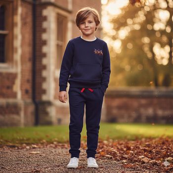 بدله رياضيه للاولاد بالشعار باللون الكحلى 